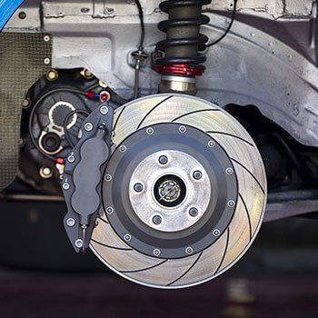 Brakes on a vehicle shown with the tire off