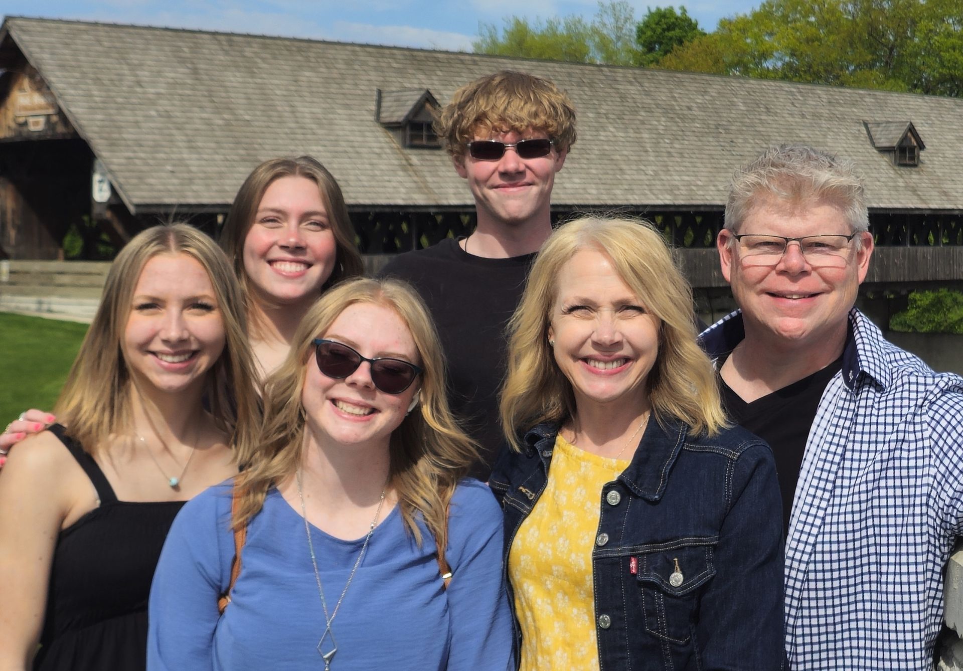 A family photo of Adam Stewart and his wife and four children