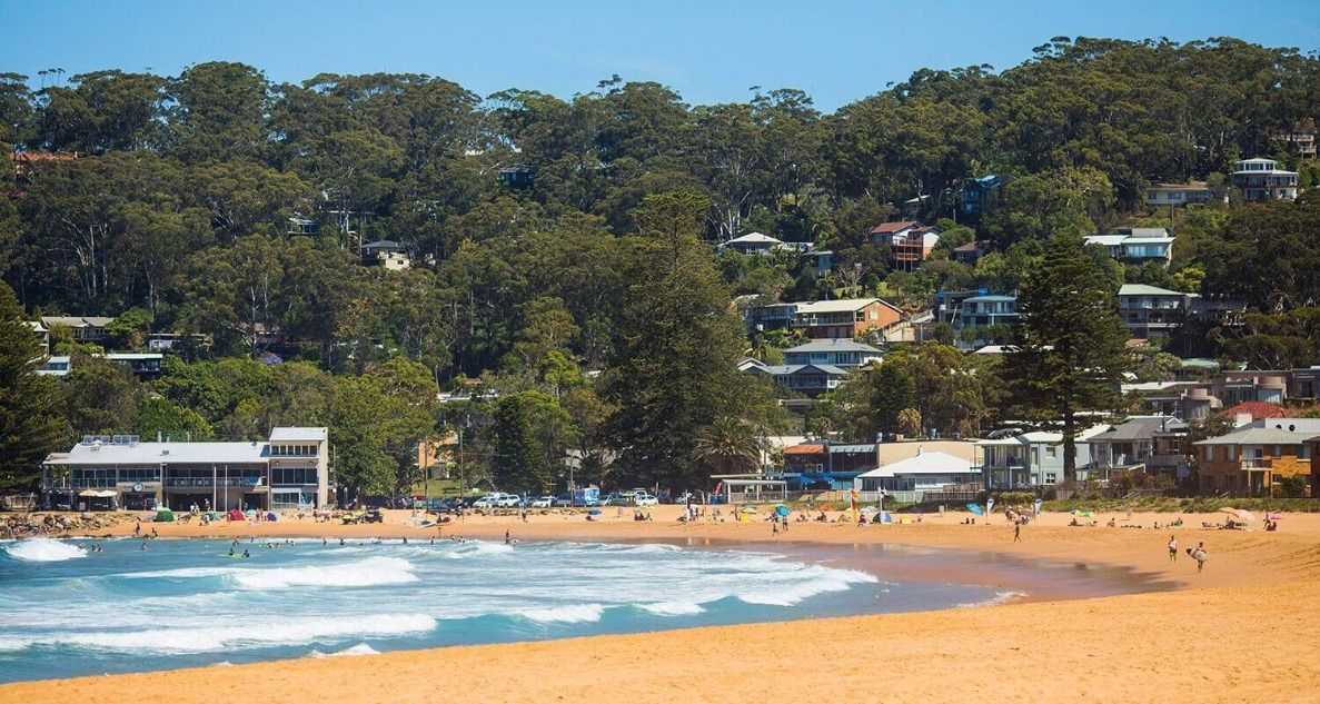 A Beach With a Lot of People and Buildings in the Background — Stephen Veigel Kitchens In Gosford, NSW