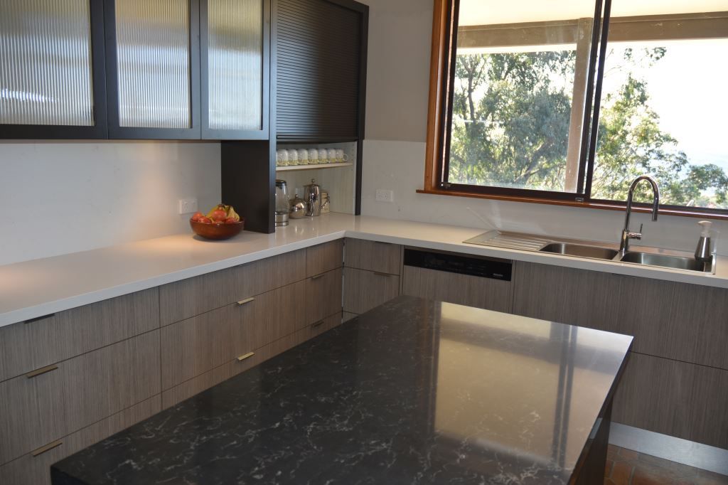 A Kitchen With a Large Island and a Sink — Stephen Veigel Kitchens In Bateau Bay, NSW