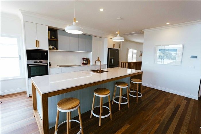 A Kitchen With White Cabinets and Stainless Steel Appliances — Stephen Veigel Kitchens In Gosford, NSW