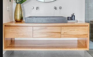 Wooden floating vanity with a gray rectangular sink, and three drawers - Stephen Veigel Kitchens In Gosford, NSW