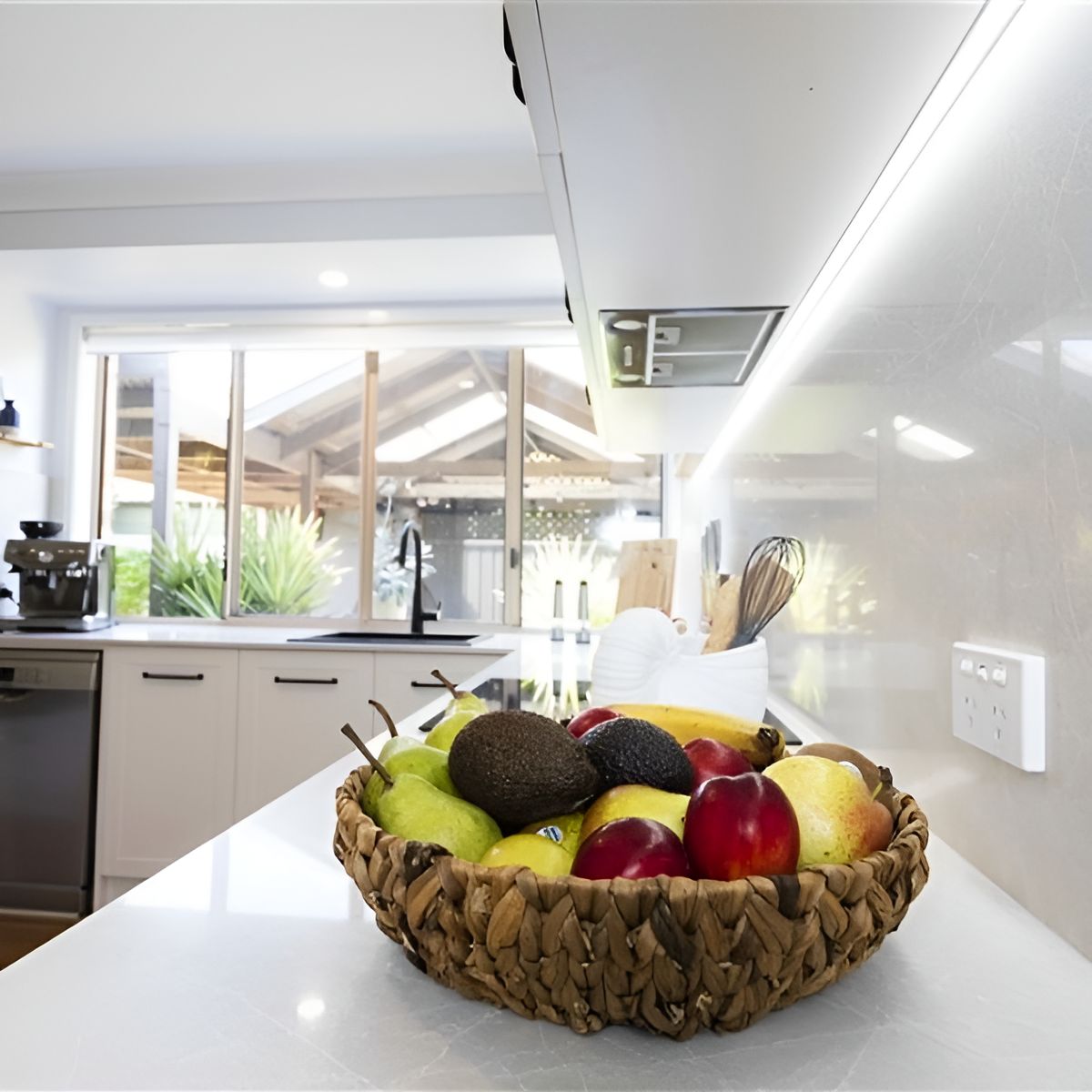A Basket of Fruit Sits on a Counter in a Kitchen — Stephen Veigel Kitchens In Woy Woy, NSW