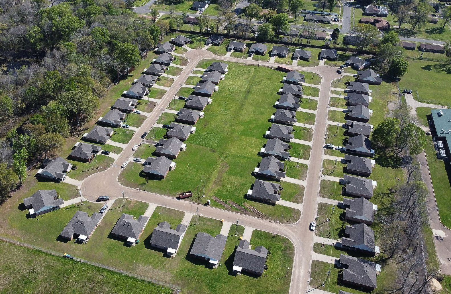 An aerial view of a residential area with lots of houses