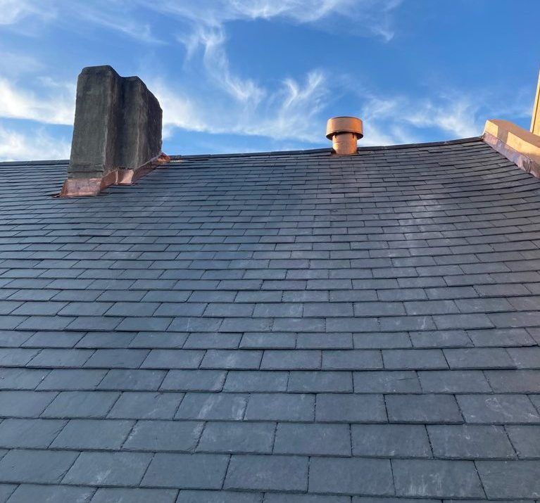 A roof with a chimney on top of it