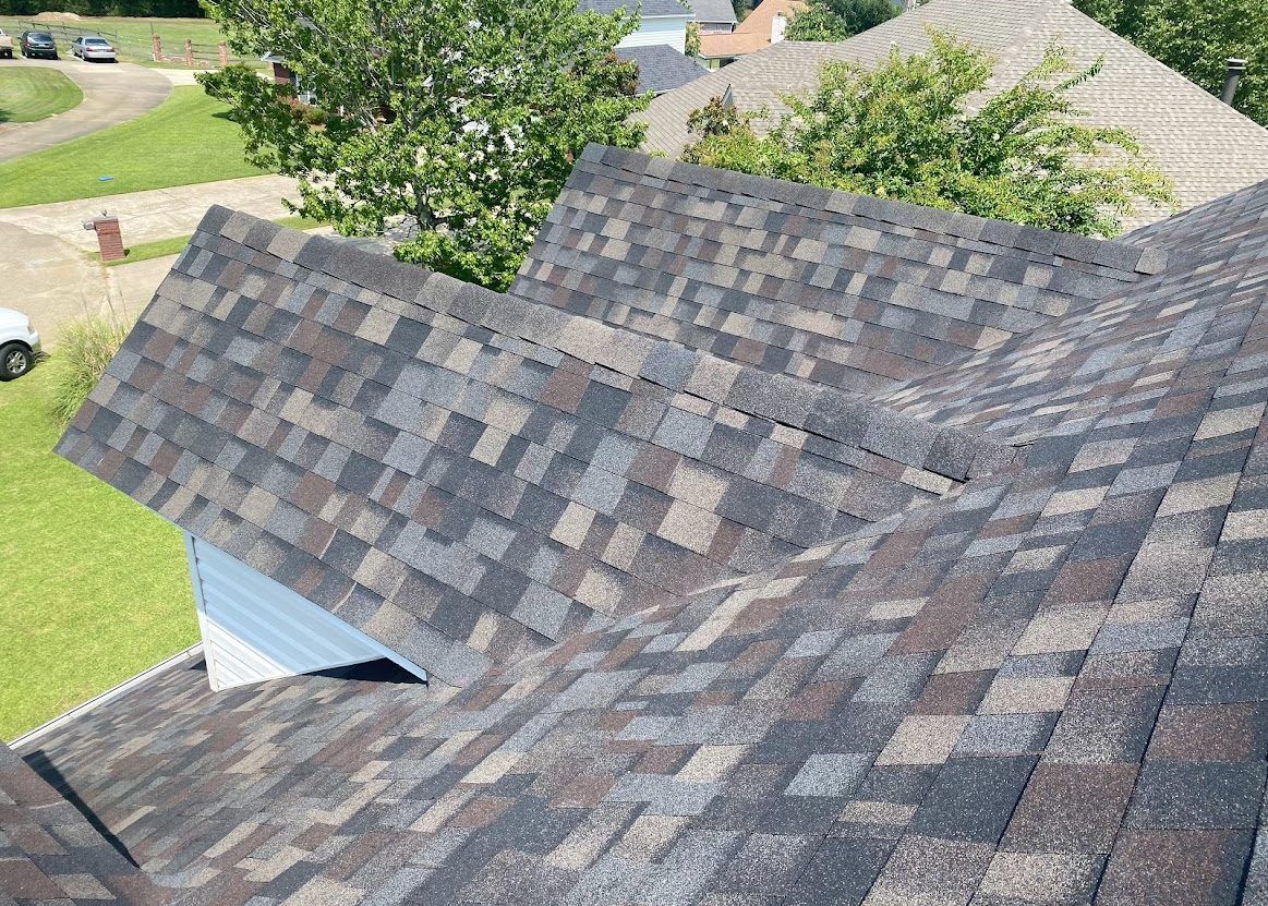 A close up of a roof with a lot of shingles on it.