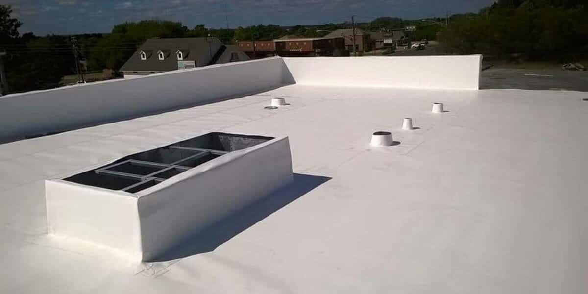 A white roof with a skylight on top of it.