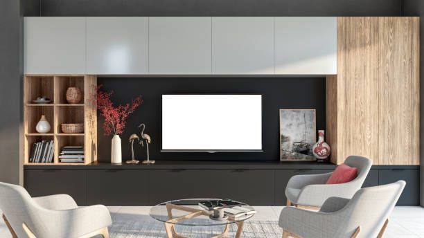 Sleek living room with black, white & wood TV cabinet, shelves, and décor.