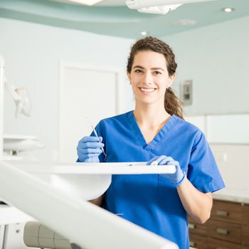 Dentist Holding Dental Equipment — Newburyport, MA — Vaka Dental Care