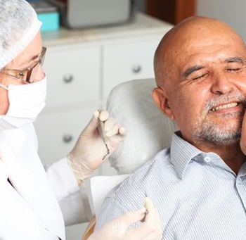 Old Man Having a Dental Treatment — Newburyport, MA — Vaka Dental Care