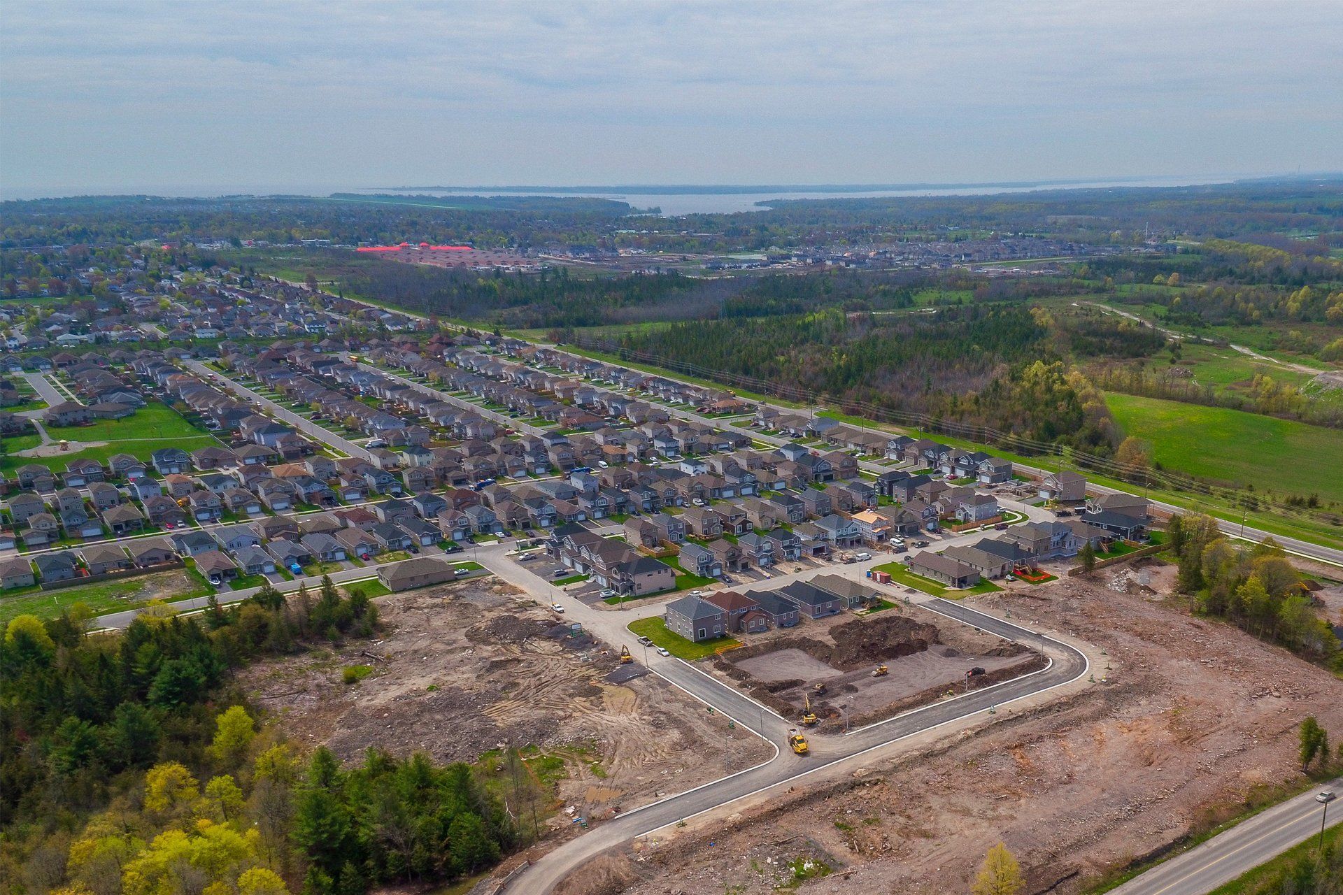An aerial view of a residential area with lots of houses and trees.