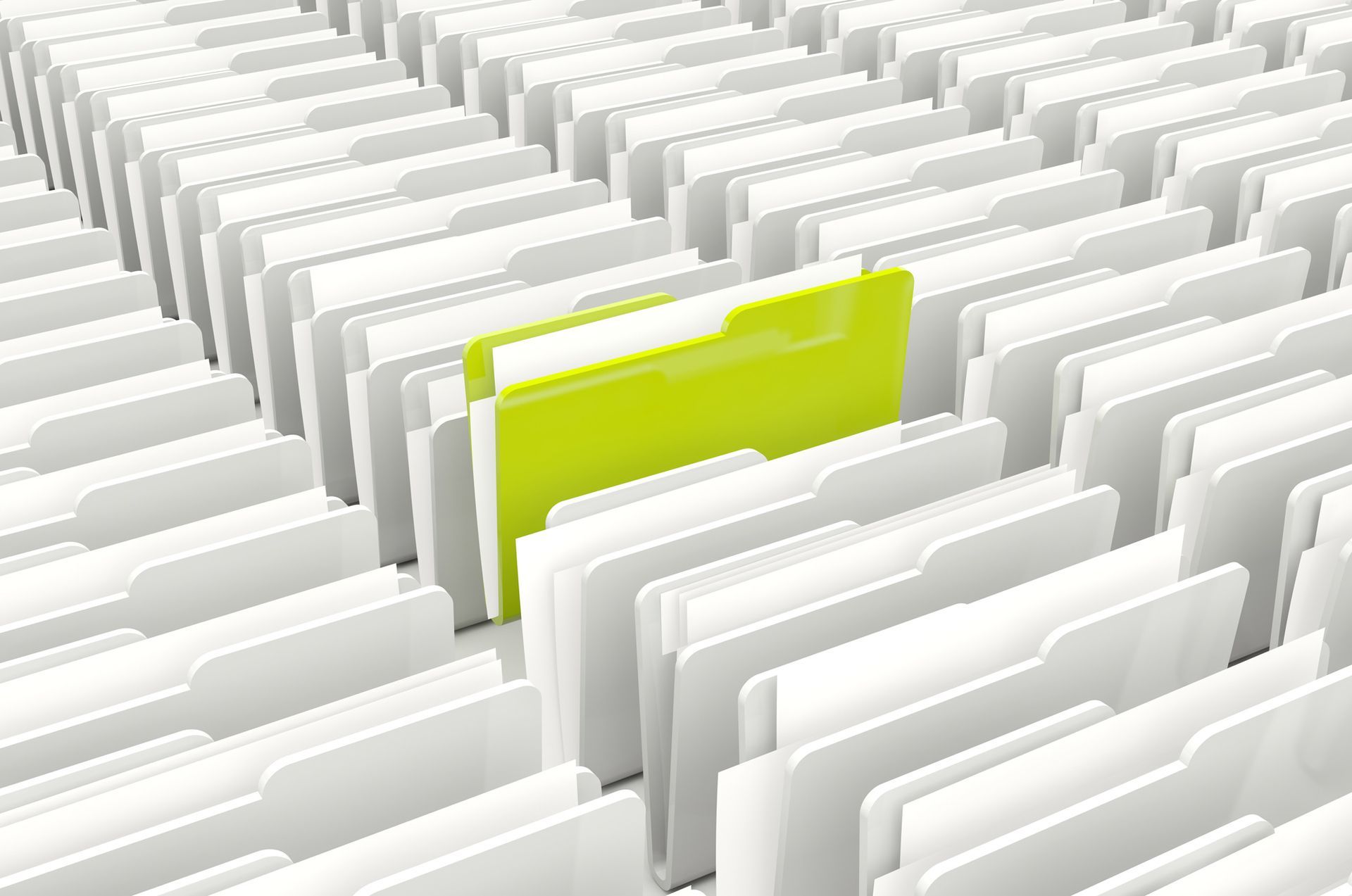Bright yellow folder among rows of white file folders in a filing system