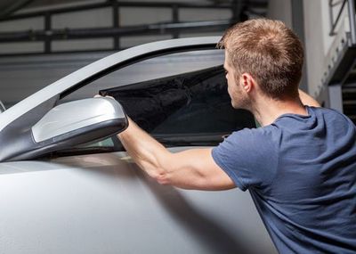 Glass Replacement — Applying Tinting Foil On A Car Window in San Jose, CA