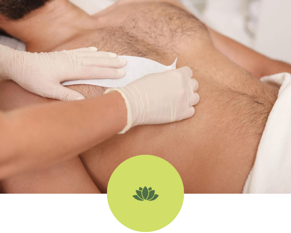 A woman is waxing a man 's chest in a spa