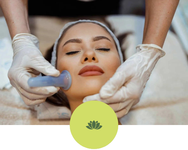 A woman is getting a facial treatment at a spa.