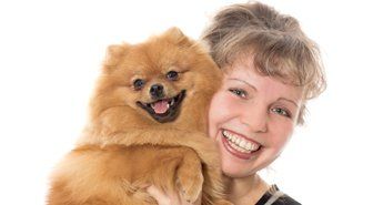 Happy young girl with her cute dog.