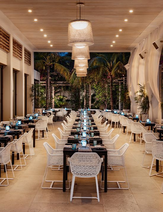 A restaurant with a lot of tables and chairs