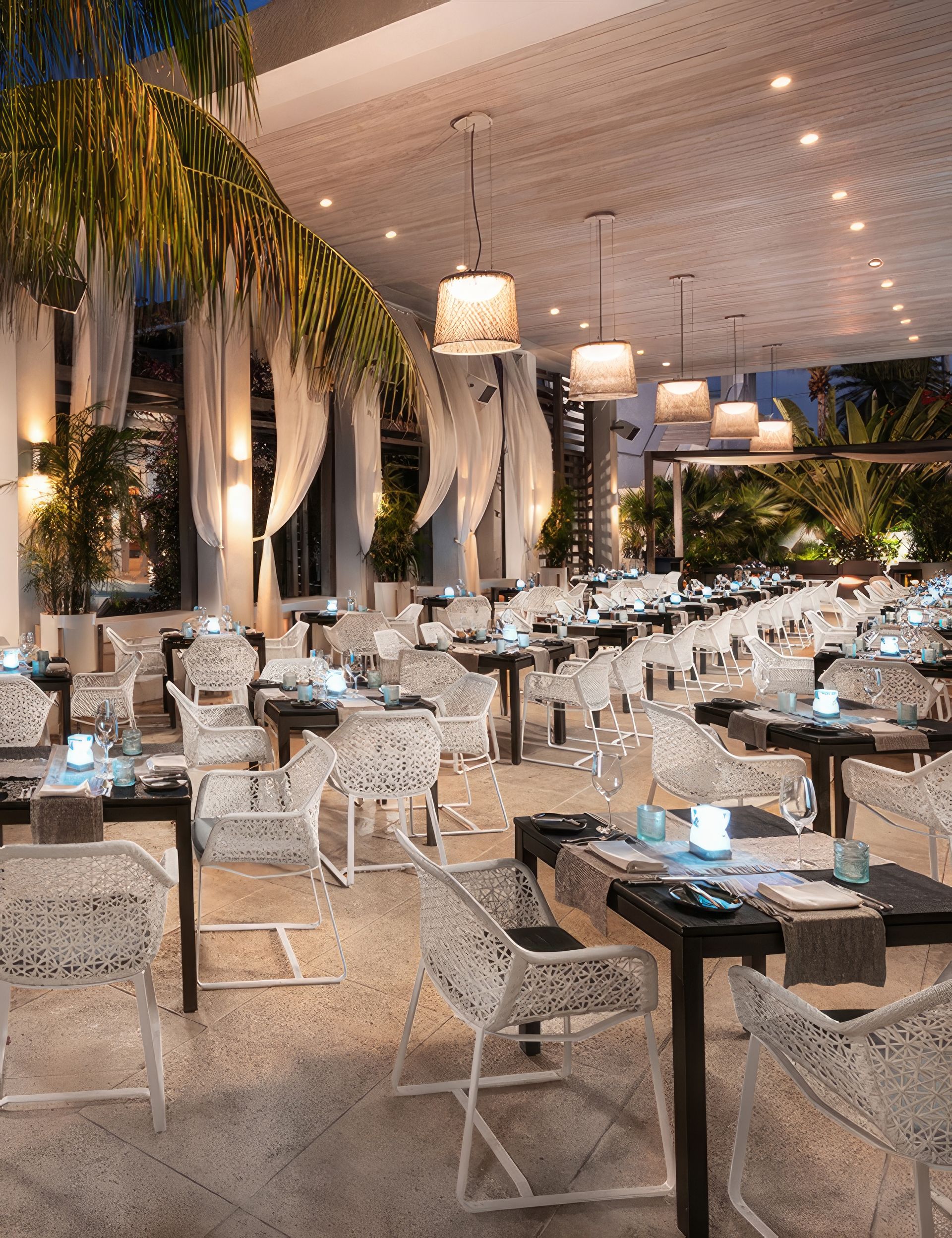 A restaurant with lots of tables and chairs