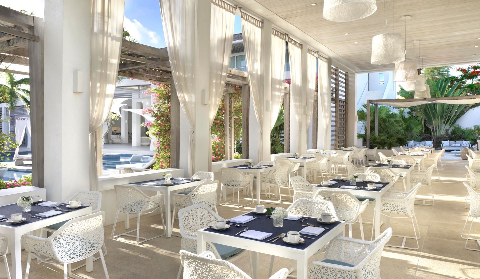 A restaurant with a lot of tables and chairs