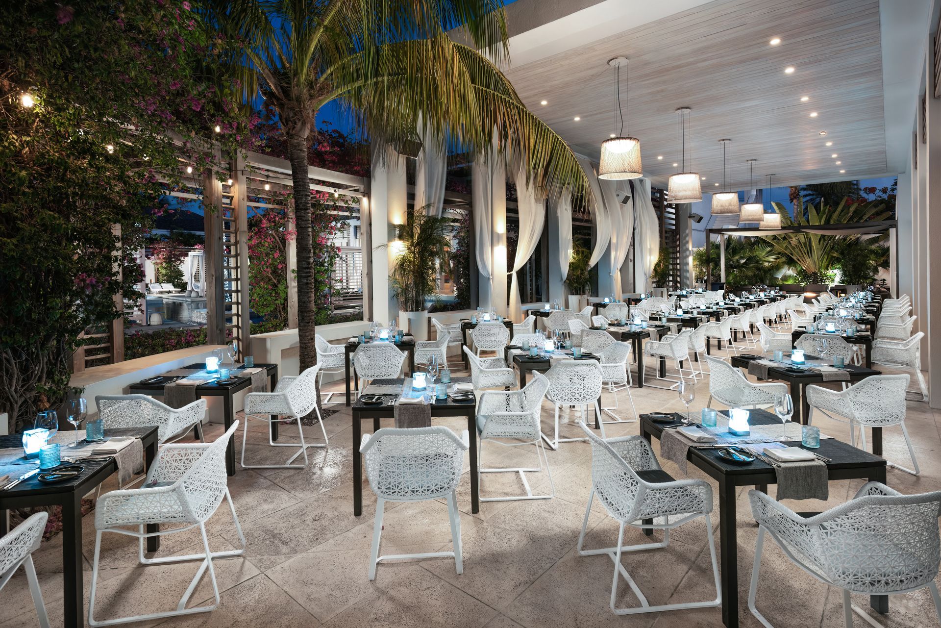 A restaurant with a lot of tables and chairs