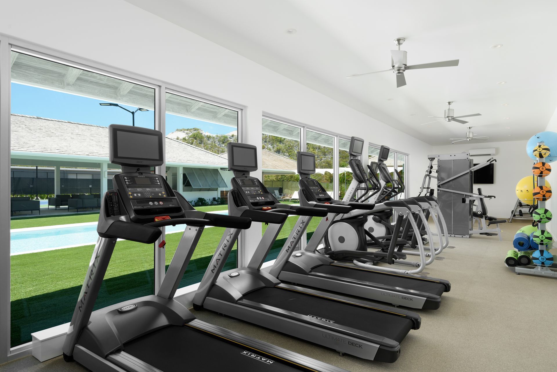 An artist 's impression of a gym with treadmills and exercise bikes