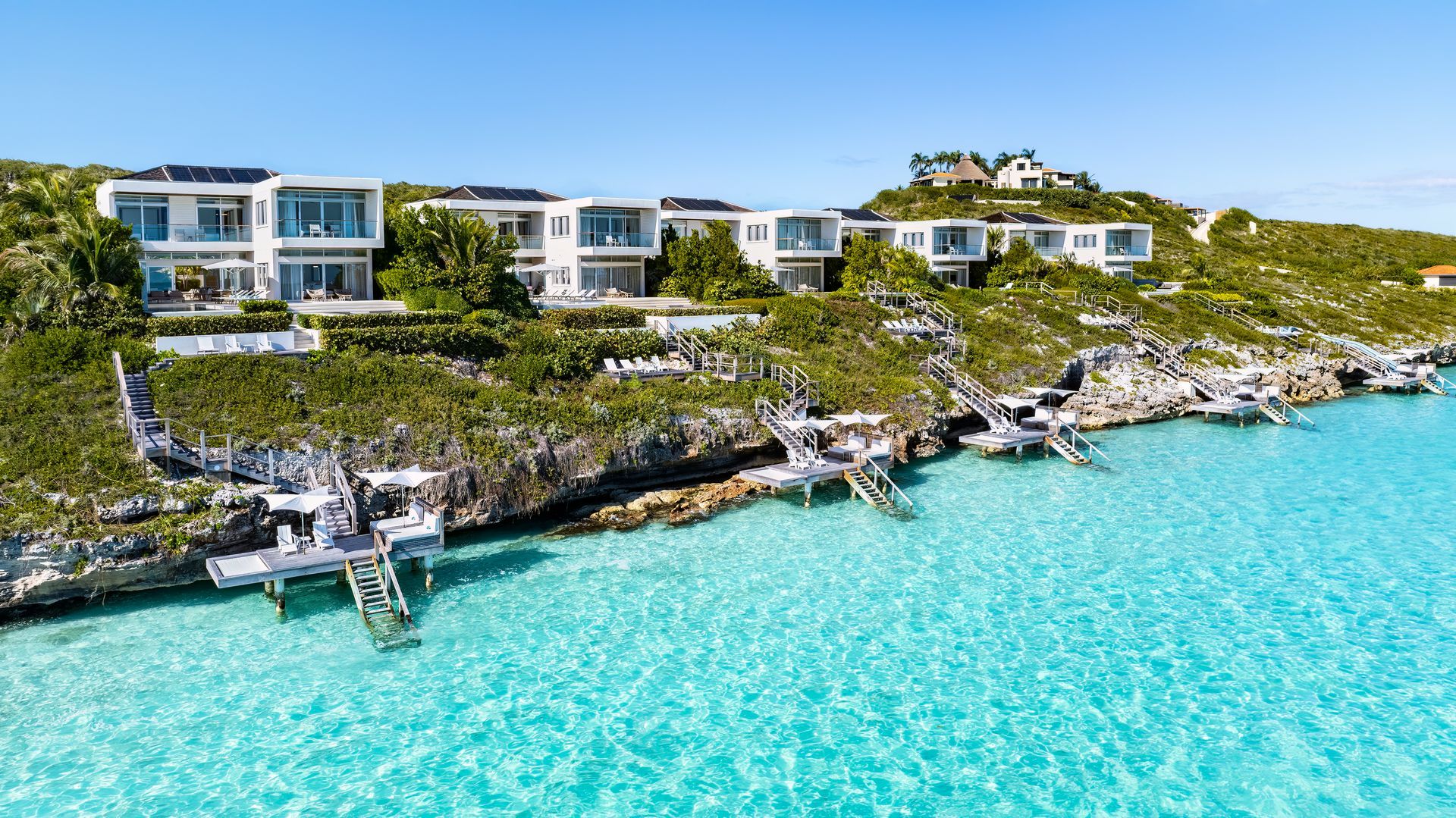 An aerial view of a luxury resort on a tropical island