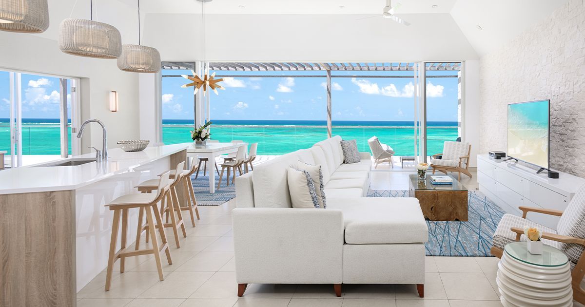 A living room with a view of the ocean