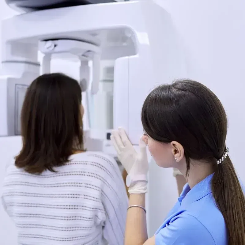 Woman getting a CBCT scan to promote optimum oral health | Dentist office near Marrero LA