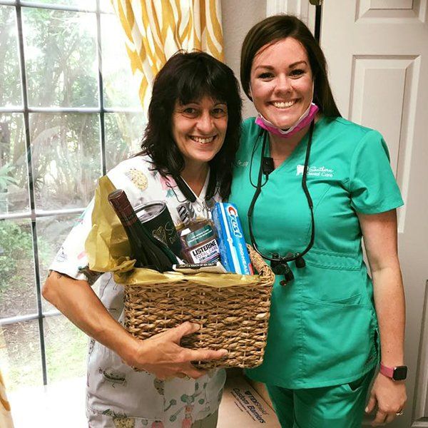 happy dentist with staff | Near Marrero LA