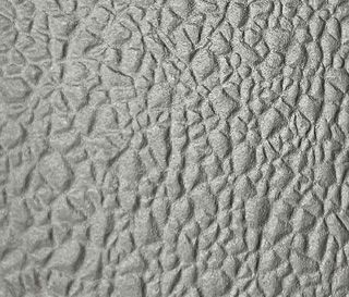 Gray, textured surface with a crumpled, bubbled pattern.