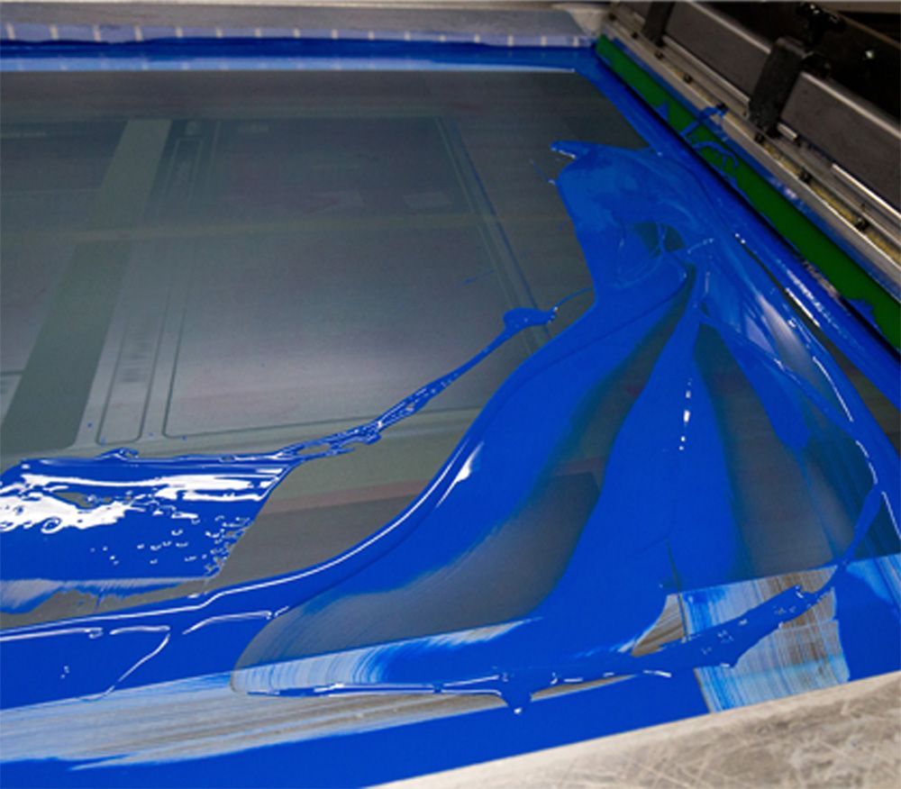 Blue ink on a screen printing mesh, a tool for transferring designs.