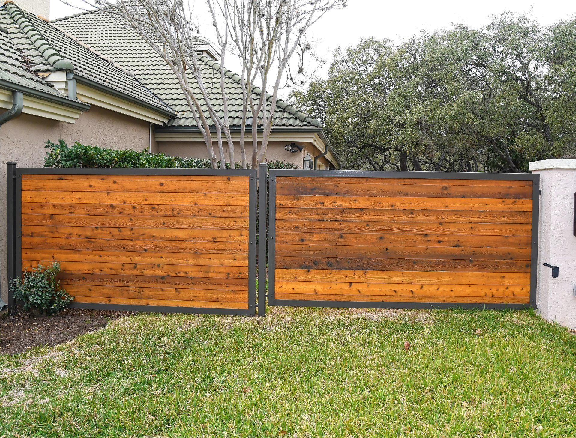 Wood Fence In Green Area — San Antonio, TX — Alamo Fence Company of San Antonio, Inc.