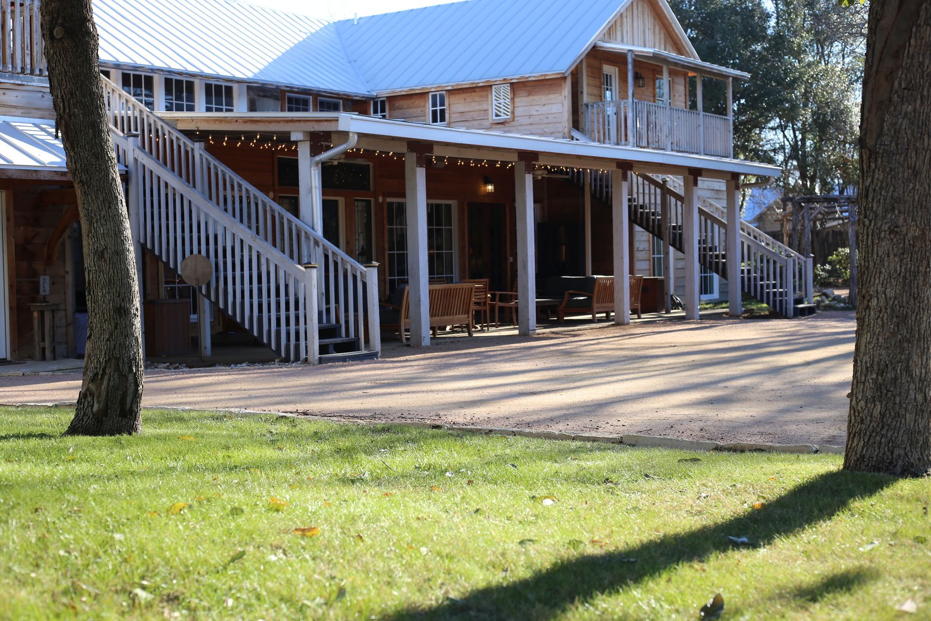 A large wooden house with a porch and stairs
