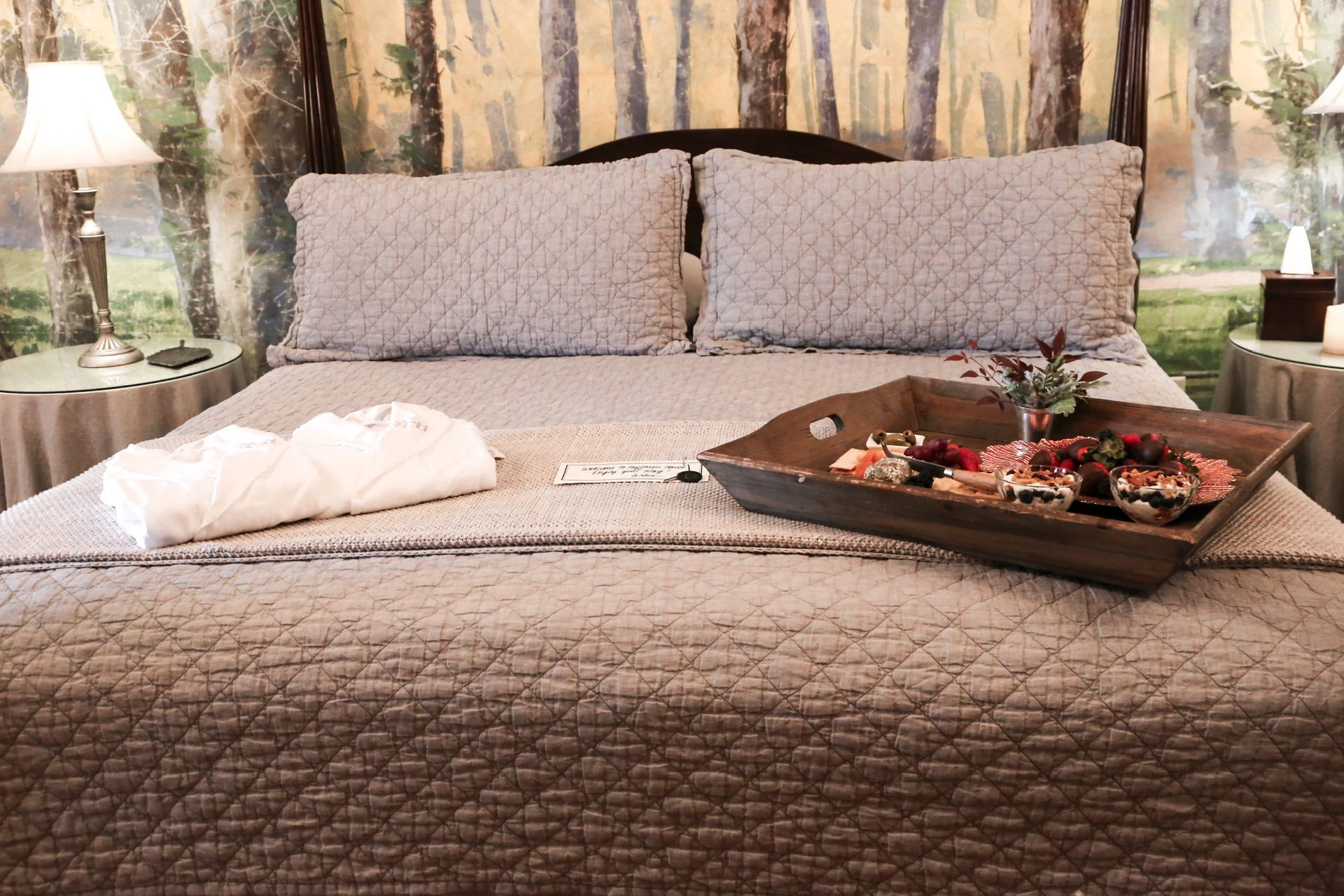 A bed with a tray of food on it