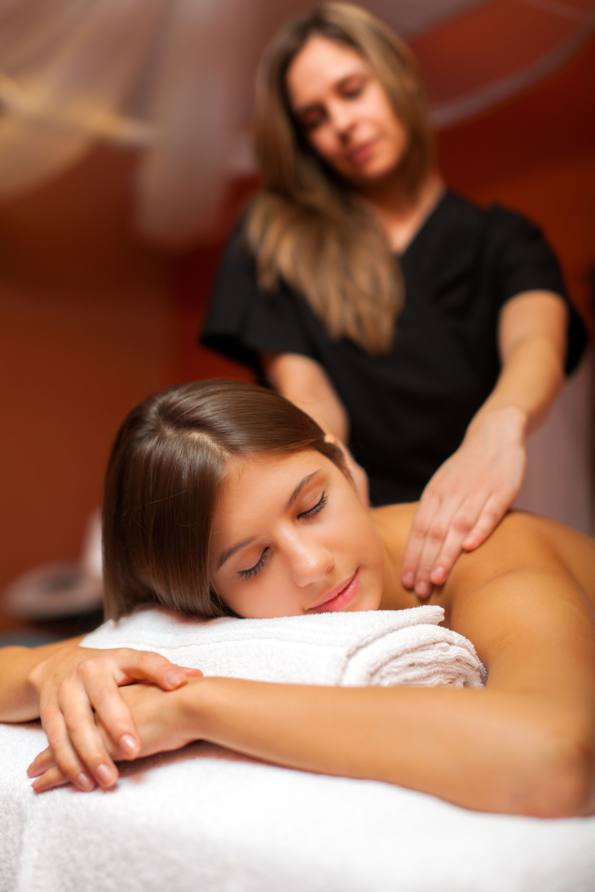 A woman is getting a massage at a spa.
