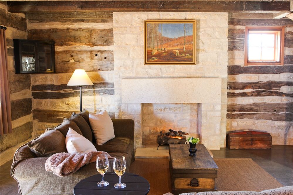 A living room with a fireplace and a couch