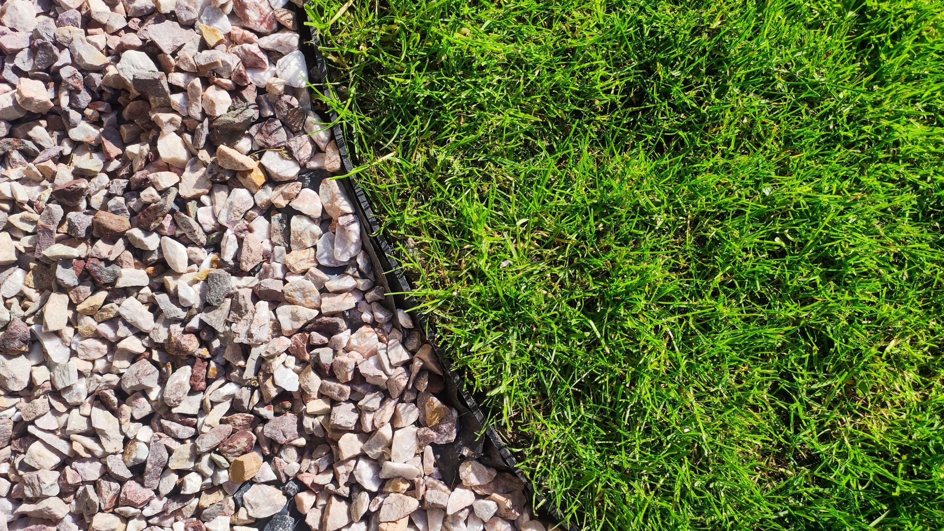 A close up of a lawn and gravel.