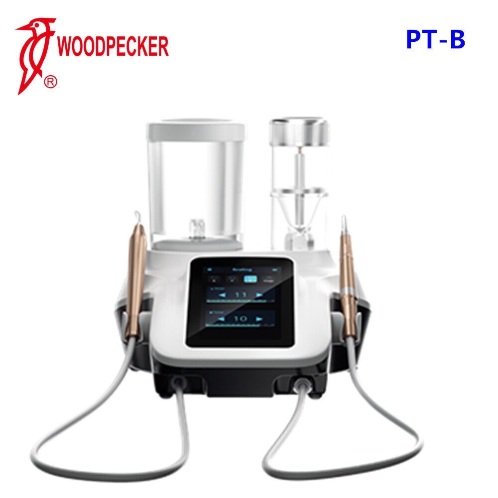 Woodpecker PT-B tandheelkundige ultrasone scaler. Zilveren apparaat met twee handstukken, twee reservoirs en een scherm.