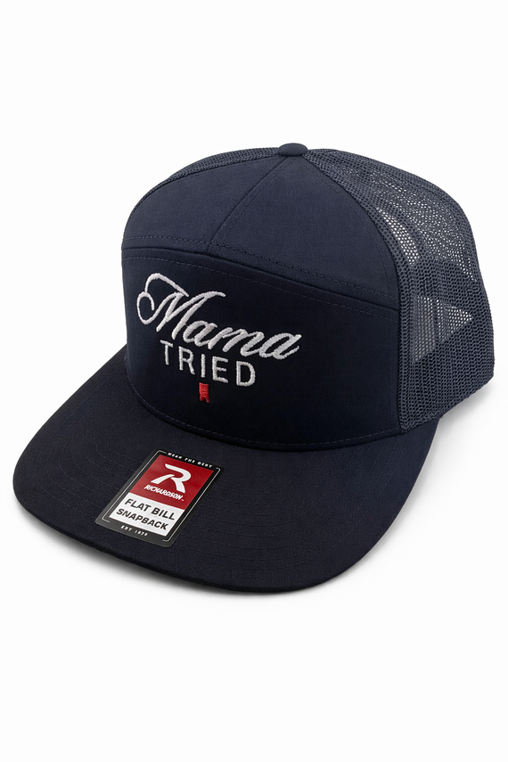 A navy blue trucker hat featuring the embroidered text 