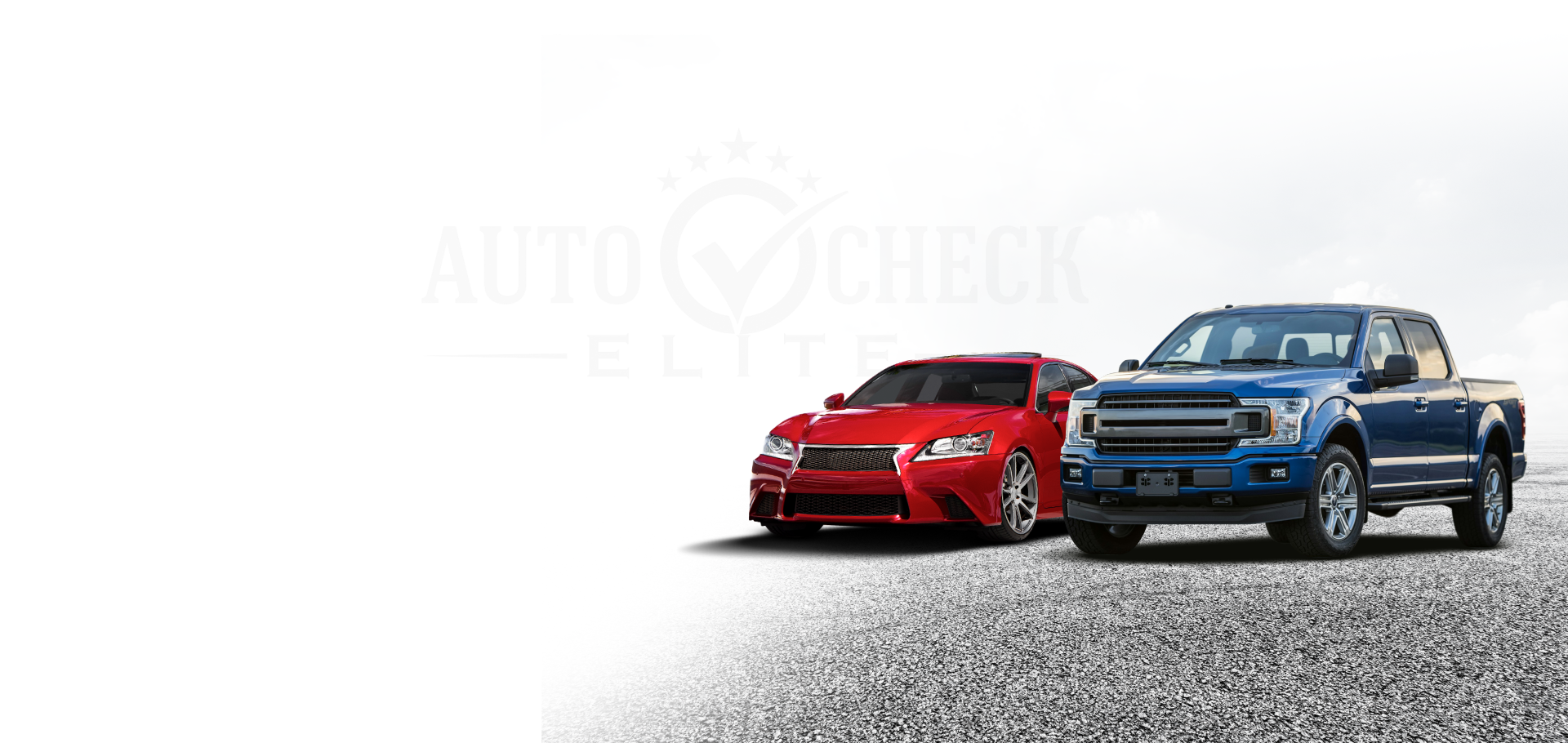 Red sports car and blue pickup truck on a gravel surface. 