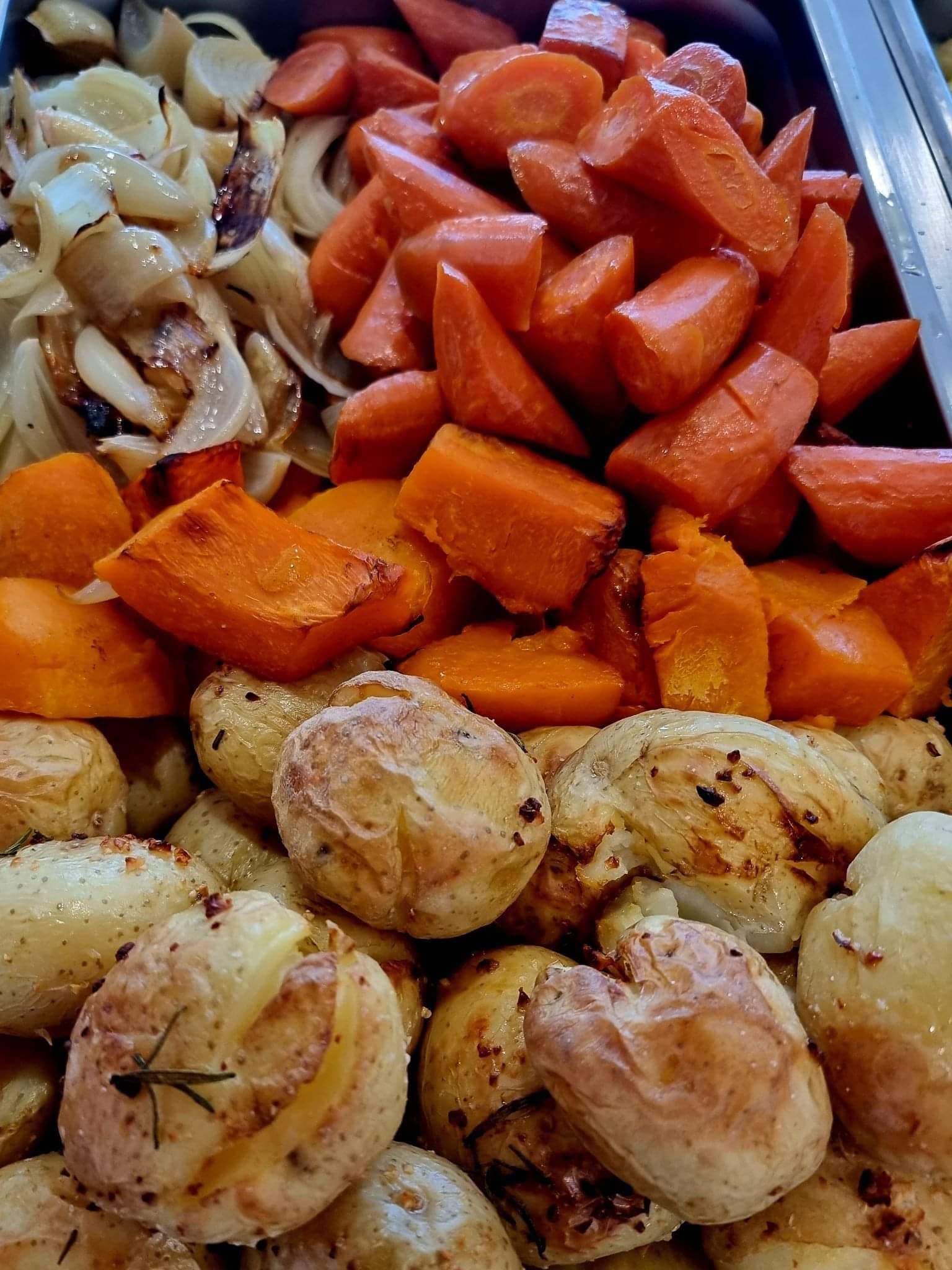 A Large Piece Of Meat Is Sitting On Top Of A Tray Of Food — Carpenter Carvery in Wendouree, VIC