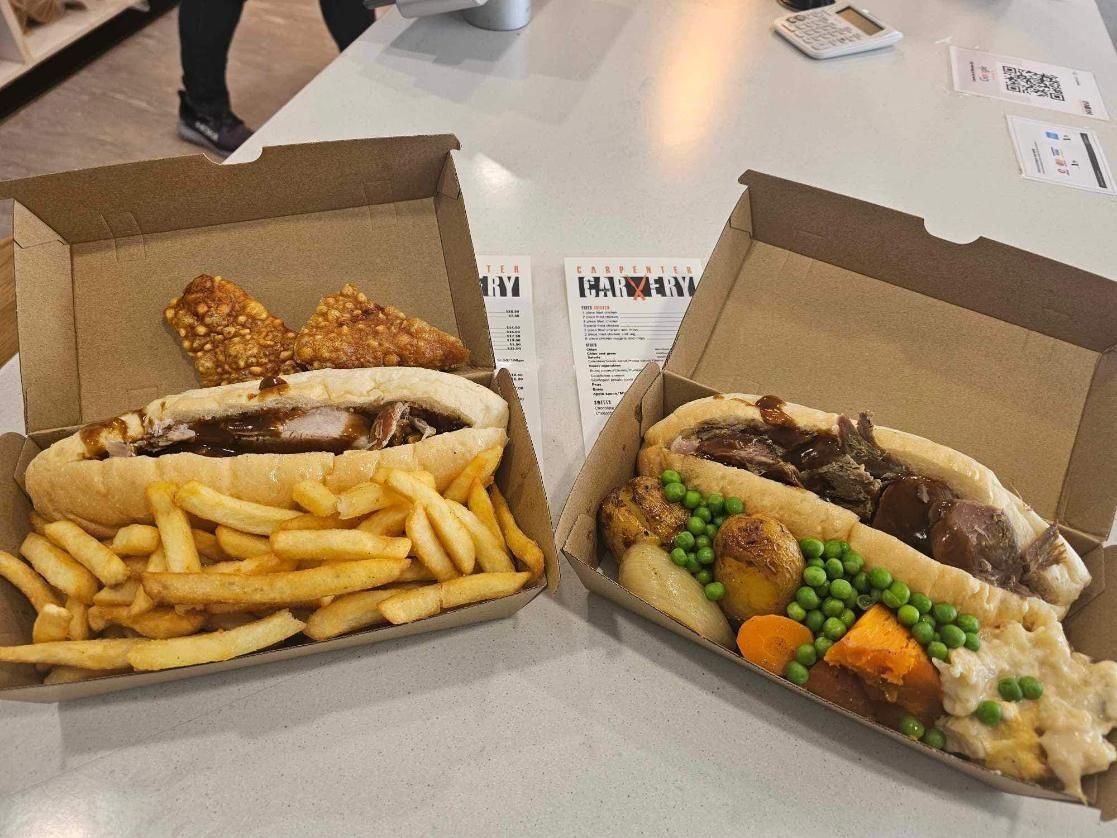 Two sandwiches are in cardboard boxes on a table — Carpenter Carvery in Wendouree, VIC