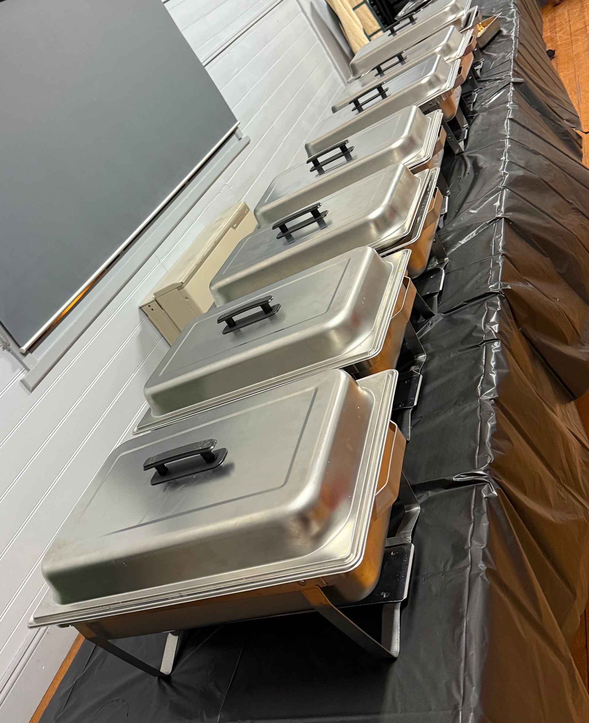 A Long Buffet Table Filled With Lots of Food In Containers — Carpenter Carvery in Wendouree, VIC