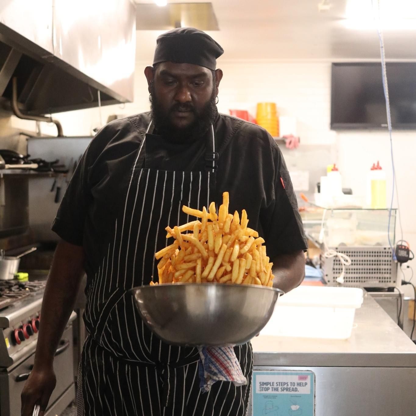 A Man Tossing A Bowl Of Chips — Carpenter Carvery in Wendouree, VIC