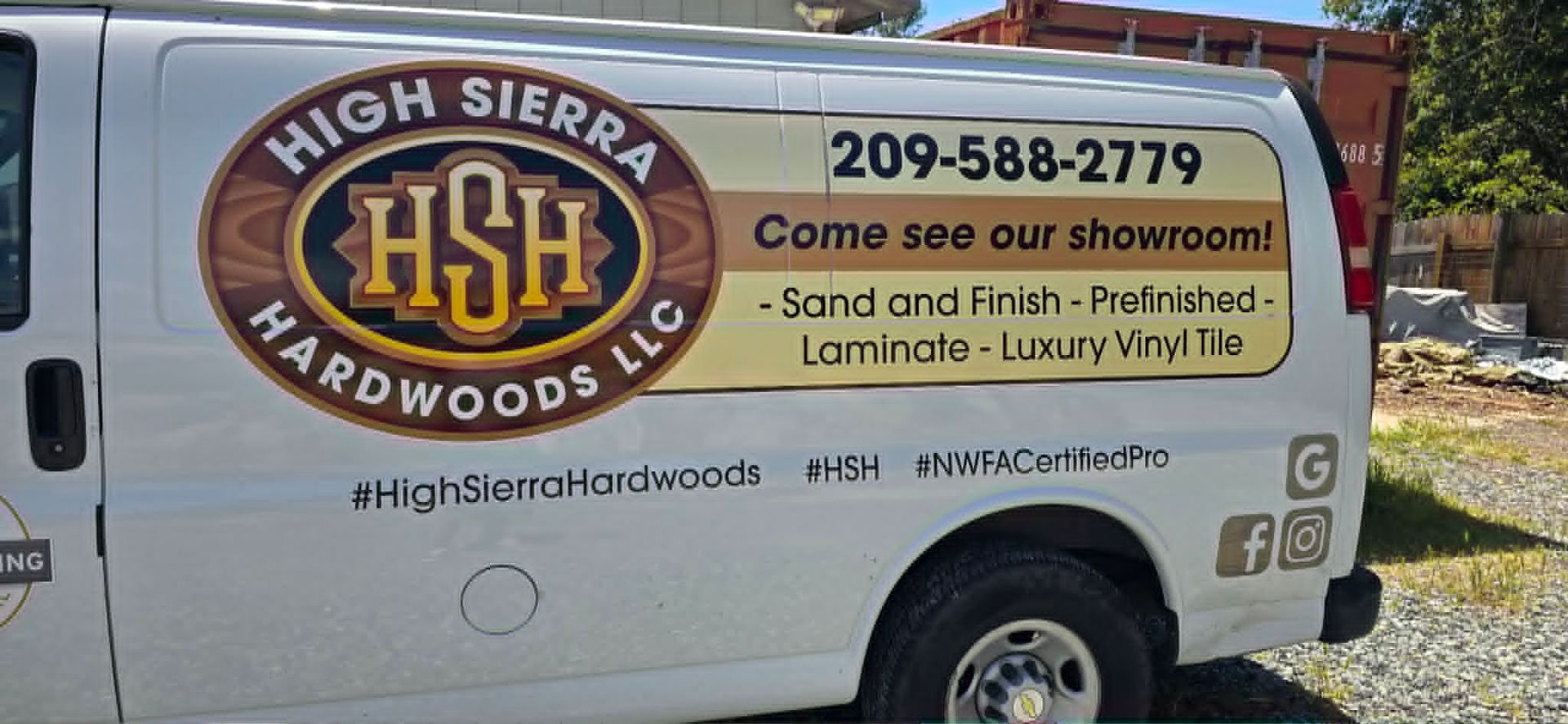 High Sierra Hardwood LLC truck with logo, phone number, and wood flooring services advertisement on the side