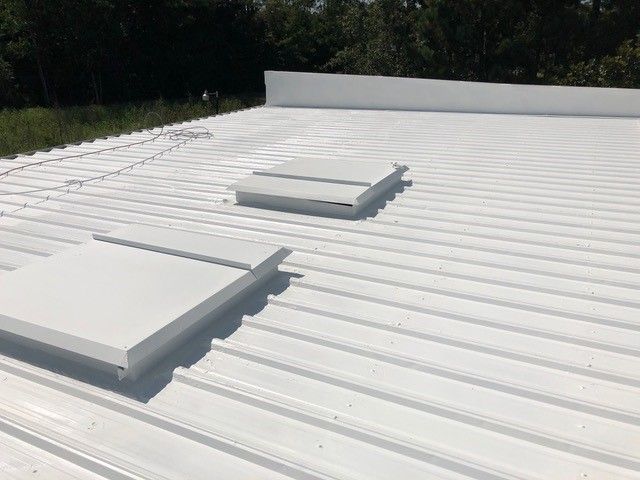 White metal roof with two skylights.