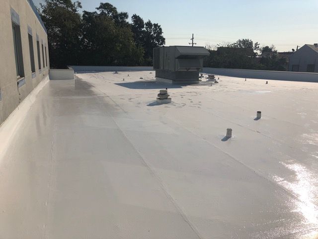 White coated flat commercial roof.