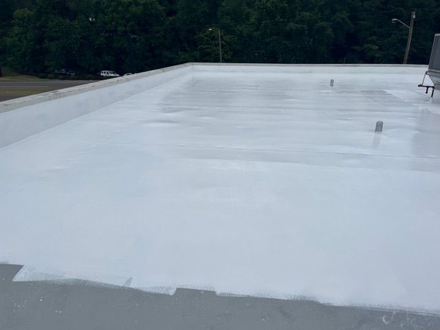 White-coated flat roof. The setting is outdoors.