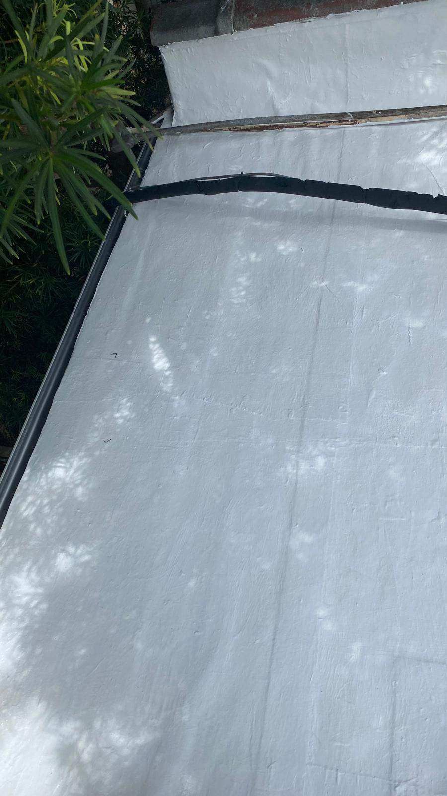 White roofing material with black trim on a building.