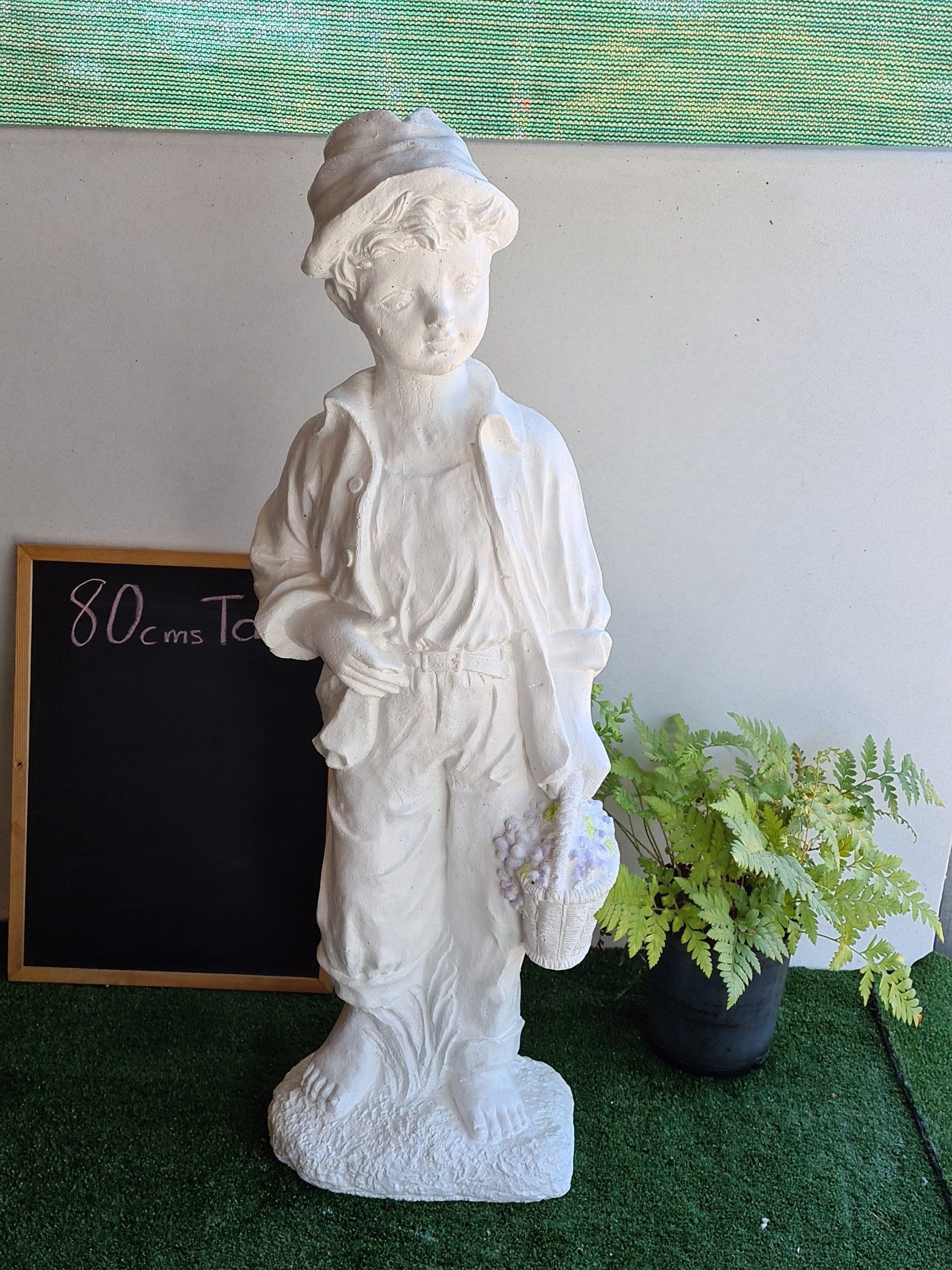 Concrete boy with Grapes